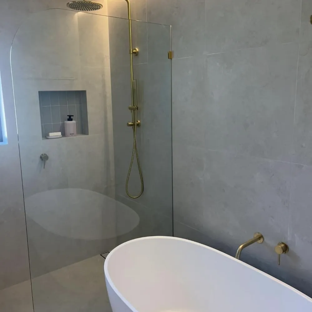 Bathroom with walk-in shower, brass tapware and freestanding bath