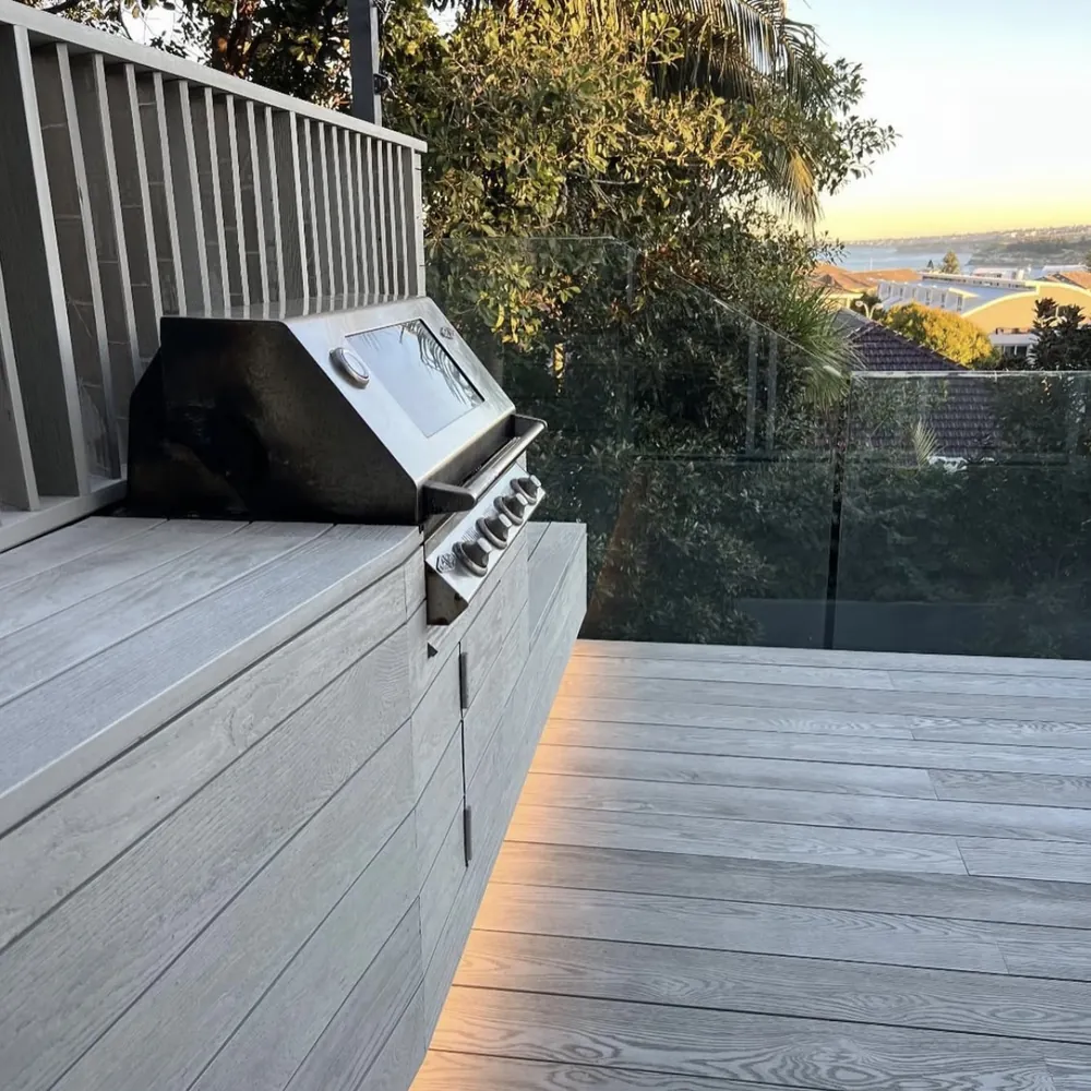 Timber deck with built-in barbecue and a view over the suburbs